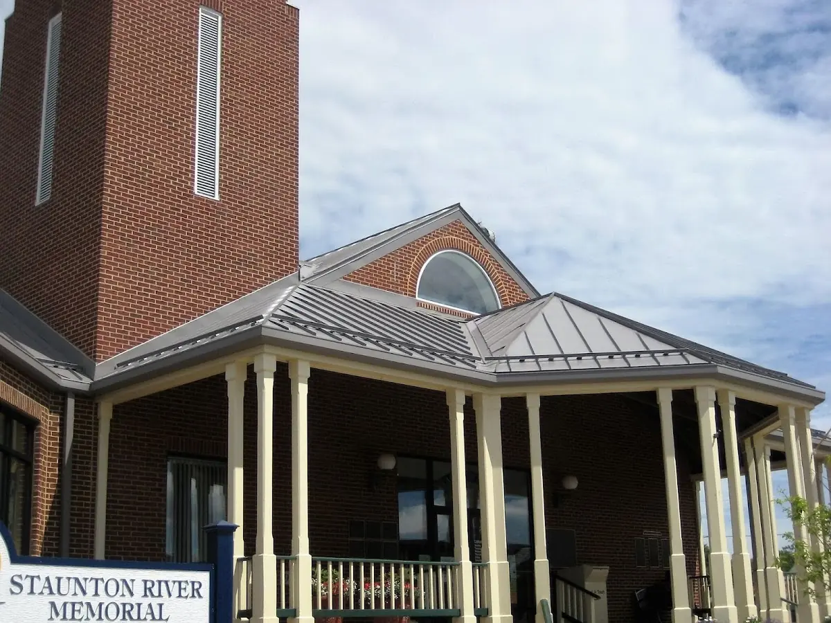 Skilled roofing craftsmen working on a residential roof in Zebulon